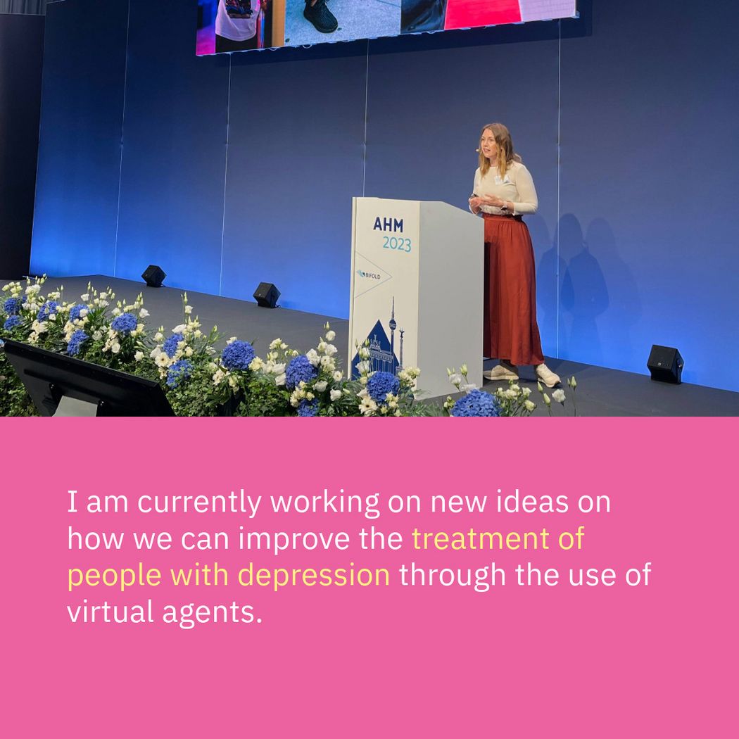Photo of Katja speaking at a conference next to the following quote: I am currently working on new ideas on how we can improve the treatment of people with depression through the use of virtual agents.