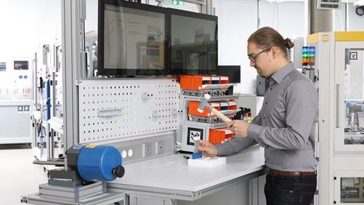 Man working on the manual work station