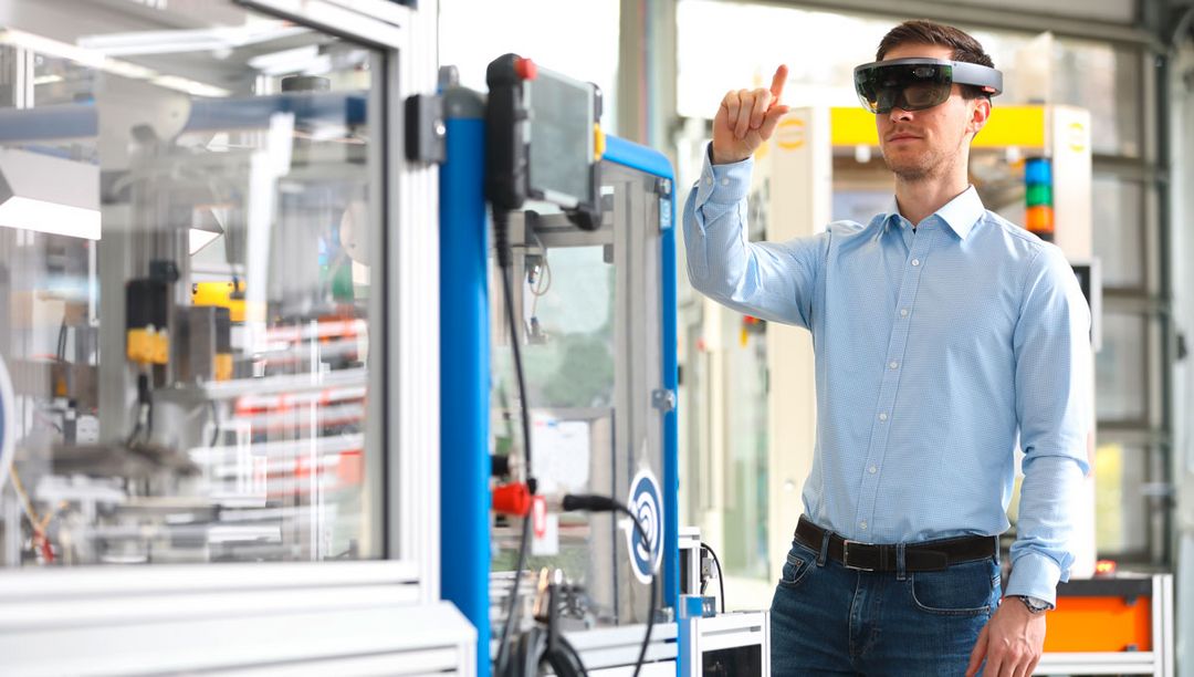 man interacting with the help of a hololens